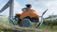 a woman riding on the back of an orange motorcycle in front of wind mills and windmills