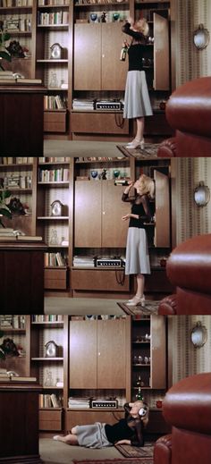 the woman is standing in front of the bookshelf