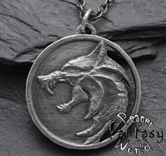 !! When you wish I can change, add or remove small objects !! Handmade Metalwork jewelry with Witcher Wolf (netflix movie) Use material : Pewter with silver Sn/Ag -925 Sterling silver Patinated country of original stone: Madagascar Size :41mm (1.61Inch) With a black cord  Use link for info about Gemstones And Their Healing Power  https://peagerfantasyworld.com/gemstones-and-their-healing-power/ You can find me on : Instagram:peagerfantasyworld -Lower Prices Facebook: https://www.facebook.com/Peagerfantasyworld/ Witcher Jewelry, Witcher Necklace, Witcher Wolf, Witcher Medallion, Gold Bridal Party, Witch Pendant, Film Netflix, Wolf Pendant, Wolves Pendants