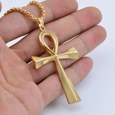 Adorn yourself with the timeless symbol of life and prosperity - our Zinc Alloy Big Ankh Cross Necklace. Crafted with intricate detail and durability in mind, this necklace features a bold representation of the iconic Ankh Cross, a revered emblem from ancient Egypt. The zinc alloy construction ensures both sturdiness and style, allowing you to wear this piece as a striking tribute to the rich heritage and mystique of Egypt. Metals Type: Zinc alloy Chain Type: O-chain We ship worldwide to 185 cou Egypt Necklace, Metal Symbol, Symbol Of Life, Ankh Cross, Ankh Necklace, Crucifix Necklace, Necklace Cross, Life Symbol, Party Necklace