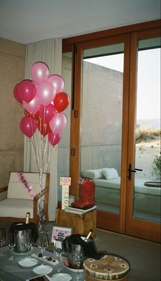 some balloons are in the air near a couch