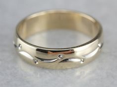 So lovely! This vintage piece is in the cigar band style, with a dotted lined pattern wrapping the ring, worn alone or against an engagement piece, this piece is sweet and timeless! Metal: 14K Yellow and White Gold Width of Band: 4.3 mm Height off Finger: 1.4 mm Ring Size: 4.50 Marks: "ARTCARVED{14KT" Stamped on the inside band Heirloom Formal Band In Round Shape, Formal 14k Gold Engraved Ring With Decorative Band, Heirloom Anniversary Band With Polished Finish, 14k Gold Bands For Formal Occasions, Heirloom Bands For Anniversary Stamped 14k, Formal Diamond Ring With Decorative Band, Heirloom Style Anniversary Bands Stamped 14k, Formal Engraved Band Rings, Heirloom 14k Stamped Bands For Anniversary