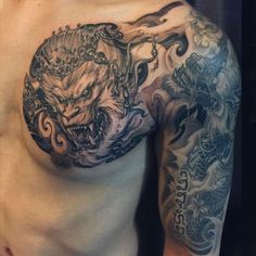 a man with a dragon tattoo on his chest