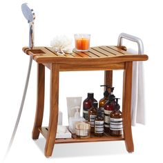 a wooden table with soaps, lotions and bottles on it