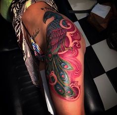 a woman with a colorful tattoo on her leg