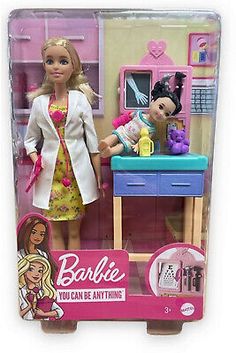 the barbie doll is standing next to her dressing table with two dolls in it's packaging