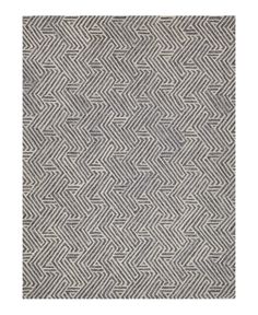 a gray and white rug with an intricate pattern