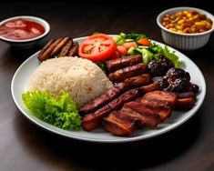 a white plate topped with meat, rice and veggies next to bowls of sauce