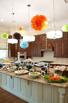 a kitchen filled with lots of food on top of a counter