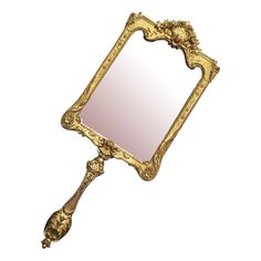 an ornate gold framed mirror on a white background