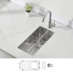 an image of a kitchen sink that is under the faucet