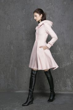 "Keep warm + elegant + stylish in this classic pink wool coat from Xiaolizi. The winter coat made from soft wool material in a fit and flare silhouette. The womens coats topped with a button-down placket + hooded collar. The swing coat finished with ruffle long sleeves + side-entry pockets. ** Detail ** * Wool composition \" 45% wool blend + fiber \" ; An excellent high-quality wool, a beautiful retro wool, The wool itself isn't a thick high end wool but it's very warm and just perfect. Making i Chic Long Pink Pea Coat, Chic Pink Wool Coat, Chic Stand Collar Wool Coat For Winter, Chic Wool Coat With Stand Collar For Winter, Chic Pink Wool Outerwear, Elegant Long Sweater Coat For Spring, Elegant Hooded Winter Outerwear, Chic Winter Pink Pea Coat, Chic Pink Winter Pea Coat