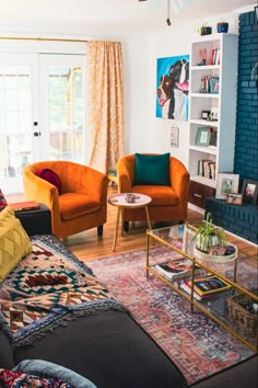 a living room filled with furniture and a fire place