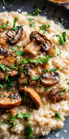 mushroom riso with parsley on top in a skillet, ready to be eaten