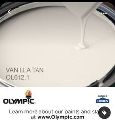 a white paint can with the words olympic on it and an image of a candle