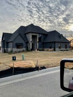 a large house sitting on the side of a road