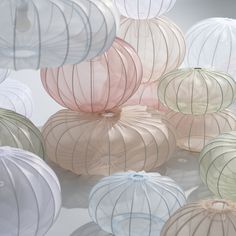 there are many paper lanterns hanging from the ceiling