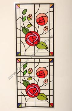 two stained glass panels with flowers on them