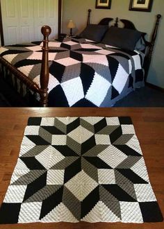 a bed with a black and white quilt on it