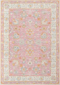 a pink rug with an intricate design on the front and back side, in various colors