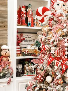 a christmas tree decorated with red and white candy canes, pepperminks, gingerbread cookies