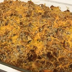 a casserole dish filled with meat and cheese