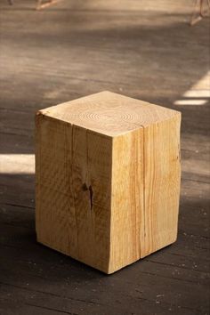 a wooden block sitting on top of a floor