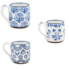 three blue and white mugs with designs on them