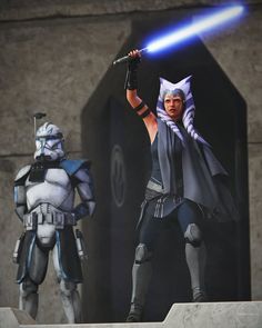 two star wars action figures standing next to each other