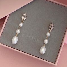 * DETAILS * - Freshwater Pearls - Gold Plated Cubic Zirconia Paved Leaf Ear post 15*8mm (Sterling Silver pin) 🎁A designer pull drawer pink gift box is available when the gift wrapping option is chosen. ✨WHITE GOLD earrings are available. https://www.etsy.com/JinnysJewelryBySeJin/listing/1291225865/freshwater-pearl-droplets-earrings?utm_source=Copy&utm_medium=ListingManager&utm_campaign=Share&utm_term=so.lmsm&share_time=1676756725062 🌟More earrings. https://www.etsy.com/JinnysJewelryBySeJin/lis Pearl White Cubic Zirconia Dangle Earrings, White Plated Pearl Earrings For Wedding, White Dangle Pearl Earrings With Plating, White Plated Dangle Pearl Earrings, Dainty Wedding Earrings With Plating, Silver-plated Pearl Earrings For Wedding, Wedding Drop Pearl Earrings With Plating, Silver Plated Pearl Earrings For Wedding, Anniversary Drop Pearl Earrings With Plating