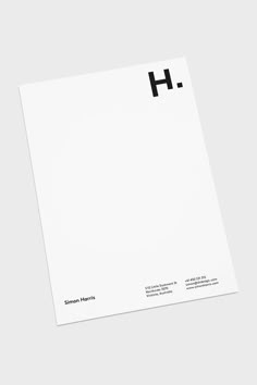 the letter h is placed on top of a white paper