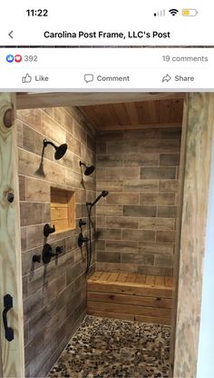 a walk in shower sitting next to a wooden bench and tiled walls with windows on each side