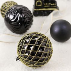 black and gold ornaments on white furnishing, with one ornament in the middle