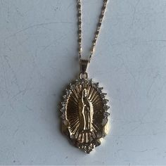 This Virgin Mary, Pendant Necklace Is Perfect For Layering W/ Your Favorite Chains For The Ultimate Mob-Wife & Y2k Aesthetic And Is Said To Offer Protection & Healing Energies, Making It A Thoughtful Gift For Those Seeking Love & Guidance. It’s Its Beauty And Significance Are Timeless. Measurements Are Included In Listing Pictures. New Without Tags. From Both A Pet Free & Smoke Free Home. Gold Chain Pendant, Virgin Mary Pendant, Virgin Mary Necklace, Mob Wife, Gold Chain With Pendant, Catholic Jewelry, Hail Mary, Chain Pendant, Y2k Aesthetic