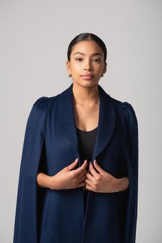 Our latest cape collection is made in a rich wool-cashmere blend, an ideal layering piece for all seasons. The Marina cape has a classic navy hue with a matching blue lining. The unique shoulder detail, a signature NN element in all our capes, creates a bold statement shoulder with the perfect silhouette. Marina is a timeless traditional cape. Add pearls, drape over a striped tee and denim for that classic coastal vibe. However you wear it, it will be uniquely yours and compliments are guarantee Elegant Navy Wool Coat, Elegant Navy Wool Coat For Fall, Navy Elegant Wool Coat, Navy Wool Elegant Coat, Elegant Blue Wool Coat, Cashmere Cape For Winter, Elegant Blue Wool Peacoat, Classic Wool Cape For Winter, Wool Cape For Formal Occasions