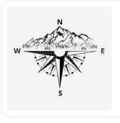 a black and white compass with mountains in the background that says wnw australia