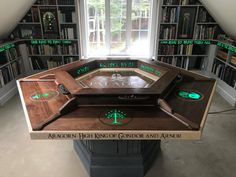 a game table in the middle of a room filled with books