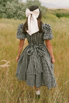 The perfect fall dress for family matching has arrived! Introducing our Cupcake Dress in Black Gingham! Featuring a timeless print, short puff sleeves, functional bow, square neckline, 100% cotton fabric and knee-length fit. This dress is lovely for any and every occasion, from apple picking with the kids to wedding celebrations and more. Gingham Dress Aesthetic, Gingham Midi Dress, Girls Fall Dresses, Thanksgiving Dress, White Bridal Dresses, Sewing Dress, Cupcake Dress, Girls Holiday Dresses, Black Gingham