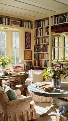 a living room filled with lots of books and furniture