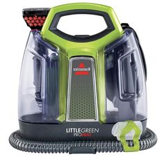 a green and black steam cleaner on a white background