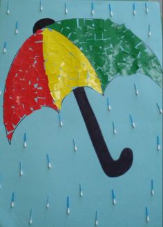 an umbrella made out of tissue paper is shown in the shape of a raindrop