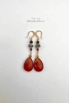 Carnelian Teardrop and Labradorite with Garnet Gold Earrings | Natural Carnelian Gold Filled Earrings | Carnelian Drop Earrings | Carnelian Earrings | Orange Stone earrings 14K Gold Filled on sterling silver ear wires Drop length 6 cm, stone diameter 18mm x 14mm, Carnelian have a beautiful shades of orange-red, The labradorite gemstones have amazing flashes of colour  Natural Carnelian has an inclusions, patterns, and cloudy patches within the gemstone, the shade of colours vary from piece to piece. This means your earrings will be completely unique These earrings are simply sweet and elegant, a gorgeous accessory for any lover of minimal jewellery and gemstones.  Carnelian restores vitality and motivation, and stimulates creativity. It gives courage, promotes positive life choices, dispel Red Carnelian Gemstone Earrings, Carnelian Gemstone Dangle Earrings, Carnelian Dangle Earrings With Natural Stones, Carnelian Natural Stones Dangle Earrings, Amber Carnelian Teardrop Earrings, Red Carnelian Teardrop Earrings, Carnelian Earrings, Pearl Headpiece, Gold Headpiece