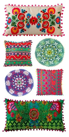 four decorative pillows with different designs and colors on the front, one in red, one in green