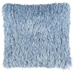 a blue shaggy pillow on a white background