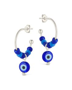 Add a touch of coastal charm to your wardrobe with these Sibyl Evil Eye Beaded Hoop Earrings. Featuring the ancient symbol of protection, these blue beaded hoops will add a hint of beachy elegance to any outfit. Embrace the luxurious and exclusive look of these earrings, perfect for any occasion. Material: 14K gold or rhodium plated brass, colored glass beads Features: 0.75" hoop, 0.6" charm, 3.75mm beads, 7.65mm evil eye bead, Lead & Nickel free, post back Adjustable Small Blue Hoop Earrings, Adjustable Small Hoop Earrings In Blue, Blue Beaded Small Hoop Jewelry, Blue Hoop Earrings With Ear Wire For Beach, Blue Hoop Jewelry For The Beach, Blue Beaded Small Hoop Earrings, Blue Small Hoop Earrings For Summer, Blue Hoop Jewelry For Summer, Adjustable Blue Hoop Earrings With Dangling Beads