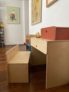 a child's desk and chair made out of plywood with different colored boxes