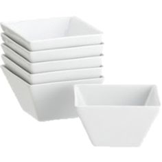 six white bowls stacked on top of each other with one bowl in the middle and four empty