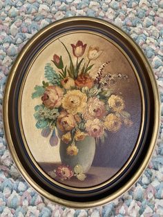 a painting of flowers in a vase on a rug