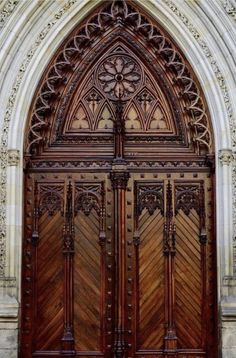 an ornate wooden door with intricate carvings on it