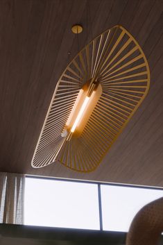 a light fixture hanging from the ceiling in a room